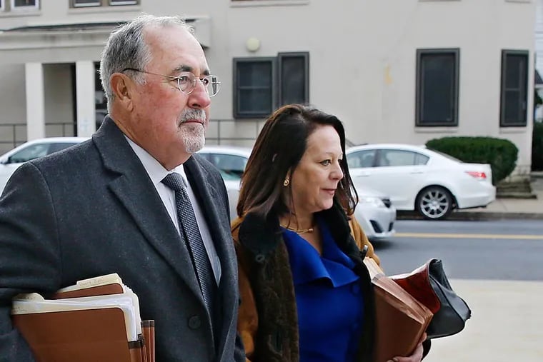 Supreme Court Justice J. Michael Eakin, left, and his wife, Heidi Eakin, right, arrive on Dec. 21, 2015, at the Northampton County Court of Common Pleas in Easton for a judicial discipline hearing.