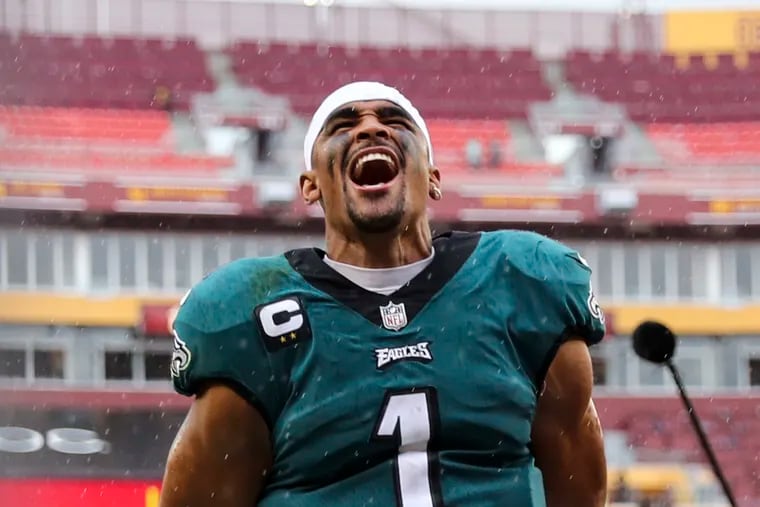 Eagles quarterback Jalen Hurts leaves the field after the rout of the Washington Commanders at FedEx Field.