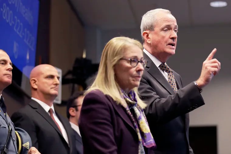 New Jersey Gov. Phil Murphy, right, is joined by state Health Commissioner Judith Persichilli, center, during a news conference in Ewing, N.J., on March 2, 2020.