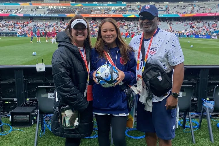 Sophia Smith's mother Mollie (left), sister Savannah (center), and father Kenny (right) on the sideline before the U.S.-Vietnam game at the women's World Cup.