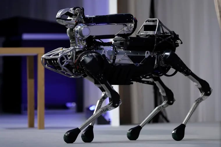 Boston Dynamics's SpotMini robot is demonstrated at SoftBank World 2017 event in Tokyo, Japan.