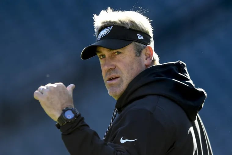 Eagles head coach Doug Pederson watches his team warm up prior to the game against the Chicago Bears November 26, 2017 at Lincoln Financial Field. CLEM MURRAY / Staff Photographer