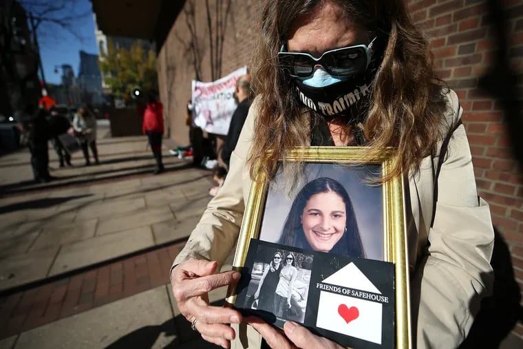 Elise Schiller, of Germantown, holds a photo of her daughter, Giana Natali, during Monday's rally outside federal court to support supervised injection sites. Natali died of an overdose in 2014.