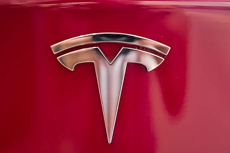 FILE - Faced with a slumping stock price and questions about demand for its vehicles, Tesla has lowered the U.S. base prices of its two most expensive models. The company on Monday, May 21, 2019 cut $3,000 from the price of the Model S sedan and $2,000 from the Model X SUV.