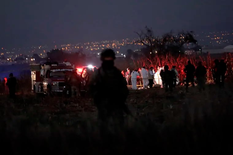 Emergency rescue personnel, the army and the police arrive to the scene of a helicopter crash where Puebla Gov. Martha Erika Alonso and her husband, Rafael Moreno Valle, a former Puebla governor, died near Puebla City, southeast of Mexico City on Monday, Dec. 24, 2018.