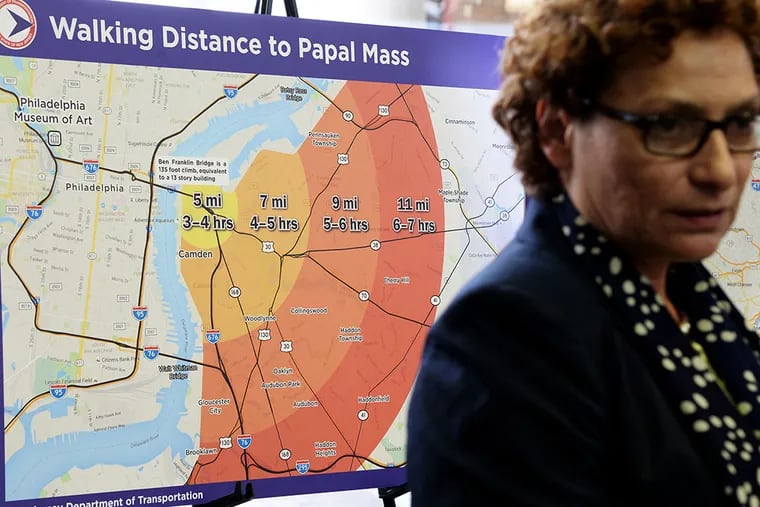A map showing walking distances from New Jersey and times to get to the site of Pope Francis' visit to Philadelphia is displayed behind NJ Transit Executive Director Ronnie Hakim during a press conference. (TOM GRALISH/Staff Photographer)