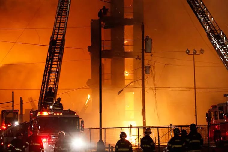 The death of 2 firefighters in 2012 Kensington warehouse fire may spur new city regulations. (JOSEPH KACZMAREK / FOR THE DAILY NEWS)
