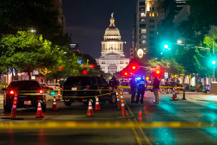 Police investigate a homicide shooting that occurred at a demonstration against police violence in downtown Austin, Texas, July 25, 2020.