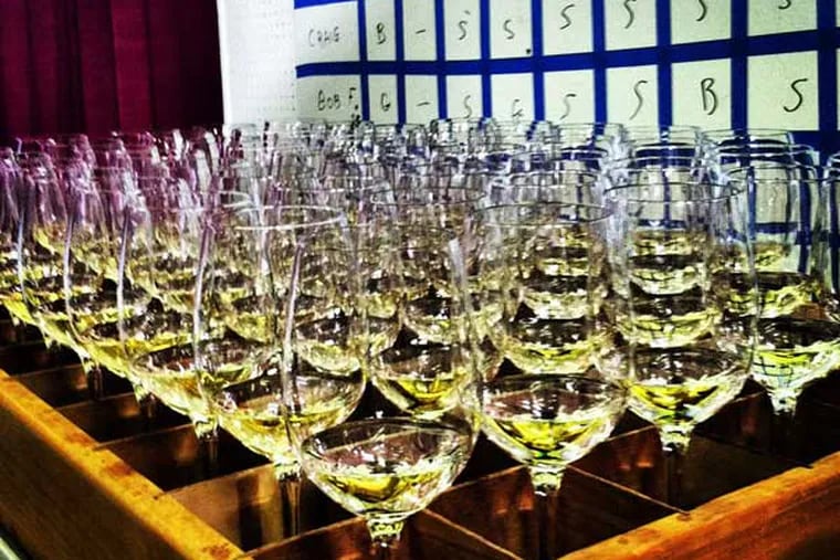 A flight of $20-$25 chardonnays is delivered to judges at the San Francisco Chronicle competition; a Camden County chard took a gold.
