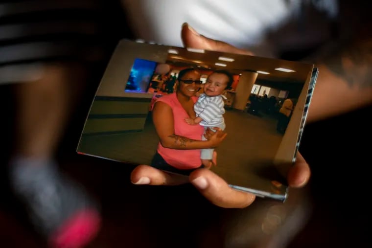 Nina Mapp of North Philadelphia holds a picture of her with her son, Hayden Mapp, who died last year while living at Pediatric Speciality Care at Philadelphia. "There was never a dull moment with Hayden," Nina said. "He told me I was strong."