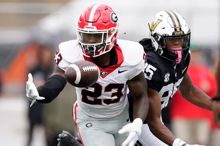 Georgia defensive back Tykee Smith (23) picks off a pass during a game against Vanderbilt in 2023.