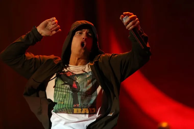 Eminem performs on Friday, Aug. 1, 2014 at Lollapalooza in Grant Park in Chicago, Ill.