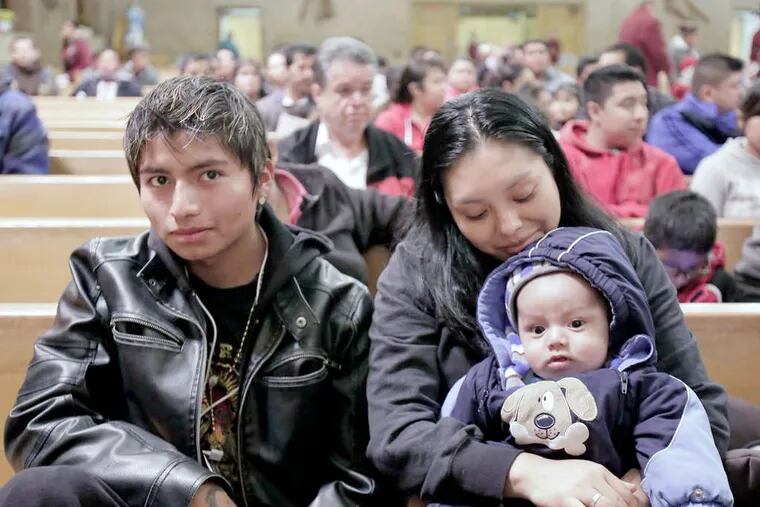 A family attending an immigration seminar in Camden last month.