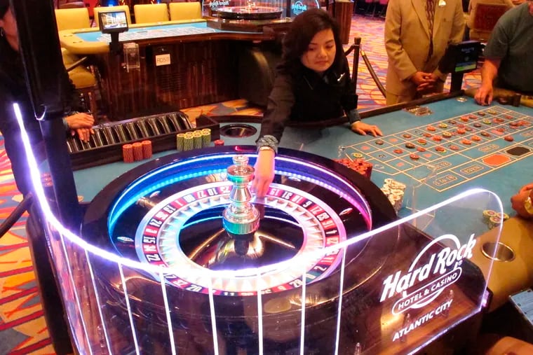 In this June 20, 2019 photo, a dealer throws the roulette ball during a game at the Hard Rock casino in Atlantic City, N.J.