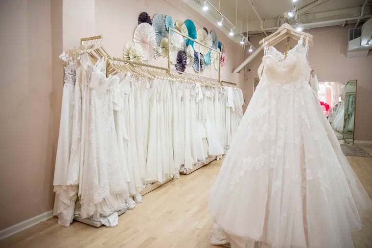 Wedding gowns line the walls of Lovely Bride Philadelphia in Philadelphia, Pa. on Thursday, August 27, 2020. Owner Ivy Solomon noted that while some wedding vendors have suffered heavily due to the coronavirus pandemic, many brides still want a gown, regardless of the size of the wedding celebration.