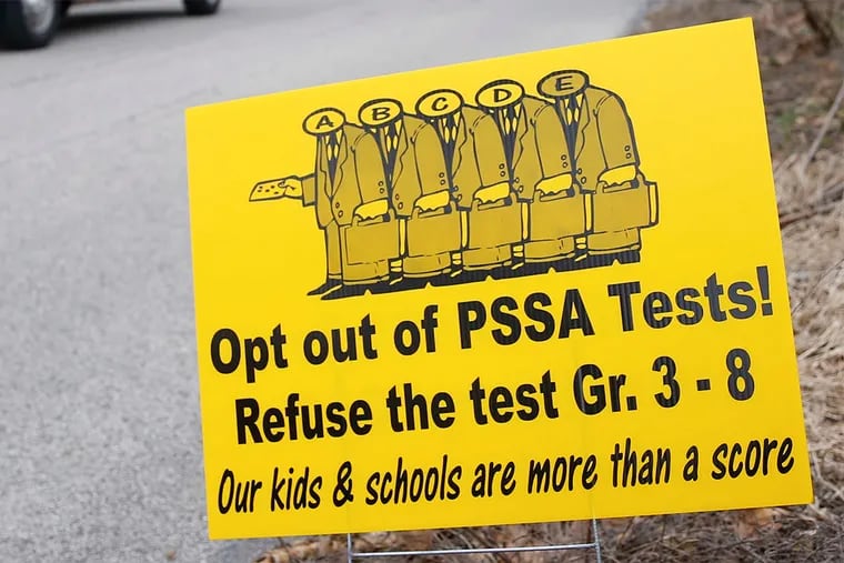 Yard signs in Lower Merion urge parents to forgo student testing.