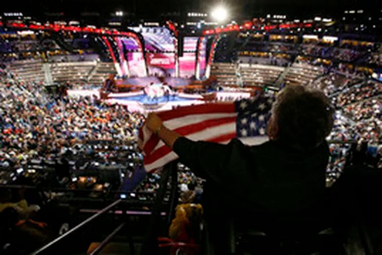 From a bird&#0039;s-eye view, Mississippi delegate Mary Troupe, executive director of the Coalition for Citizens With Disabilities, waves a flag during the convention.
