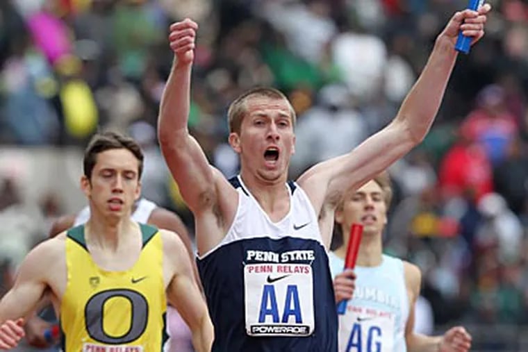 Penn State's Robby Creese celebrates his team's win in the 4x800-meter championship. (Charles Fox/Staff Photographer)