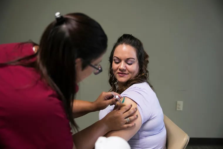 Jessica Gilbert, 33, got her second dose of hepatitis A vaccine during a South Street Ministries program in Akron, Ohio. People who ate at Ristorante La Buca in Center City between Oct. 28 and Nov. 15 are urged to get vaccinated if they have not done so already.