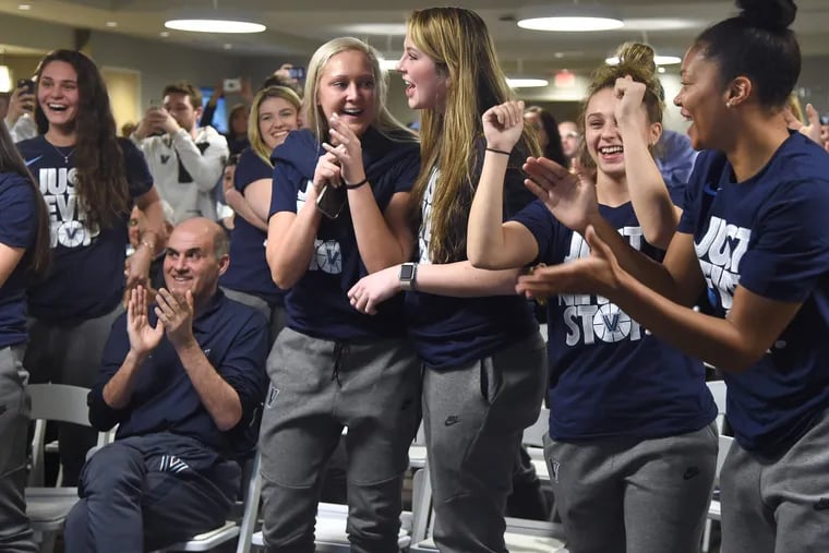 In his 40th season as Villanova women's basketball head coach, Harry Perretta remains seated as his players celebrate their return to the NCAA women's basketball tournament for the first time in five years.