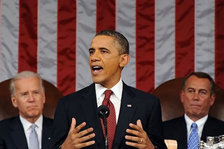 President Barack Obama delivers his State of the Union address on Capitol Hill in Washington, Tuesday, Jan. 24, 2012. Listen in back are Vice President Joe Biden and House Speaker John Boehner, right. (AP Photo / Saul Loeb, Pool)