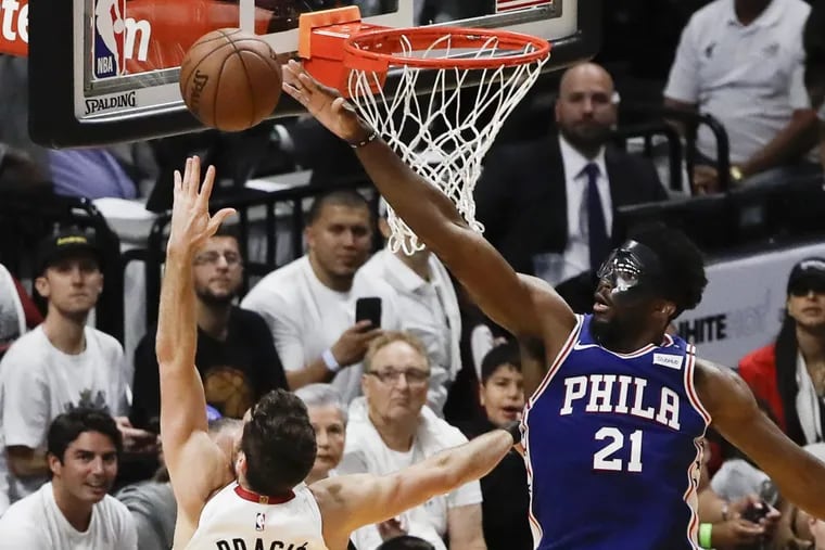 All-star center Joel Embiid, shown blocking the shot of Heat guard Goran Dragic during the Sixers’ Game 4 win on Saturday, will be making his home playoff debut as Philly looks to close out the series.