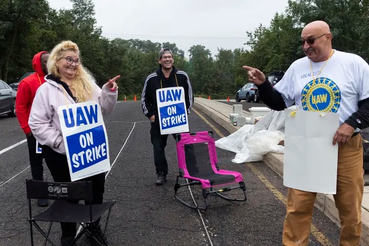 General Motors employees (from left) Omar Glover, Robin Medeiros, Rob Baran, and Bill Beier strike outside of the GM parts warehouse in Langhorne last month.