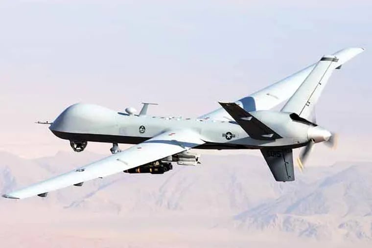 An unmanned MQ-9 Reaper , armed with AGM-114 Hellfire missiles, performs a combat mission over southern Afghanistan. LT. COL. LESLIE PRATT / U.S. Air Force, File