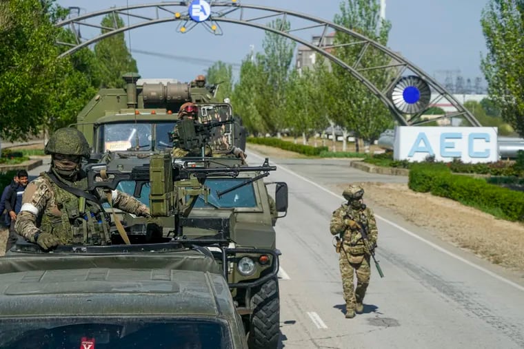 A Russian military convoy is seen on the road toward the Zaporizhzhia Nuclear Power Station, in Enerhodar, Zaporizhzhia region, in territory under Russian military control, southeastern Ukraine, on May 1, 2022. Russia has devised yet another way to spread disinformation about its invasion of Ukraine, using digital tricks that allow its war propaganda videos to evade restrictions imposed by governments and tech companies.