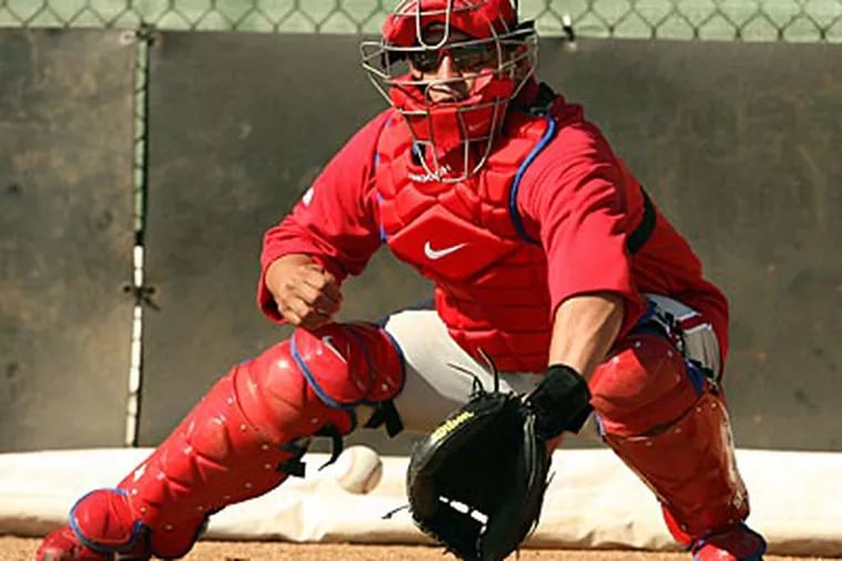 "This year is going to be something special to be behind home plate," Carlos Ruiz said. (Yong Kim/Staff Photographer)