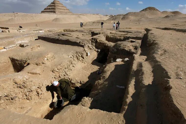 A worker toils in excavations at the Saqqara burial site south of Cairo. Newfound 4,300-year-old tombs are the beginning of a large cemetery, according to Egypt&#0039;s top archaeologist.