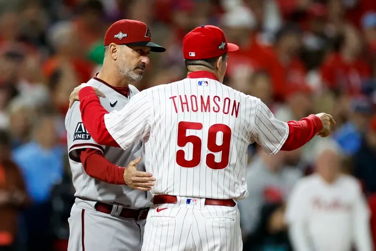 Manager Torey Lovullo of the Diamondbacks greets the Phillies' Rob Thomson before Game 1 of the NLCS on Monday.