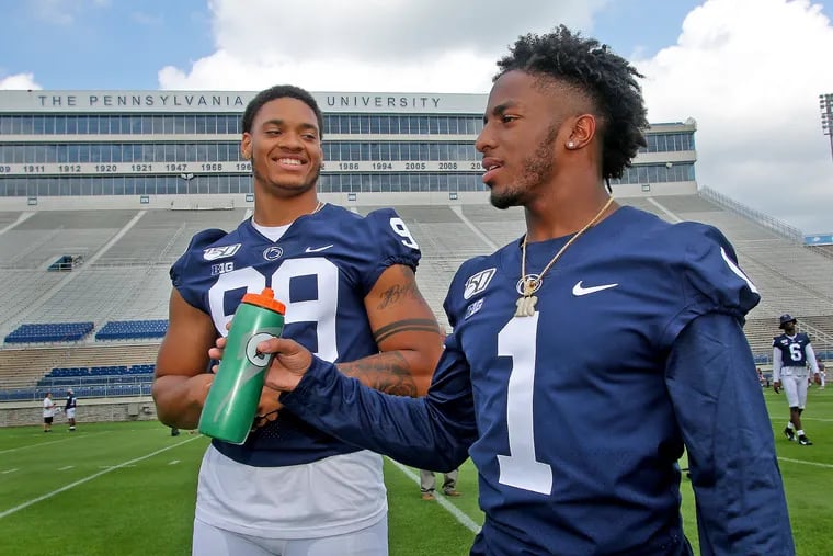 Penn State football defensive end Yetur Gross-Matos (99) and wide receiver KJ Hamler (1) during the program's annual media day on Aug. 3.
