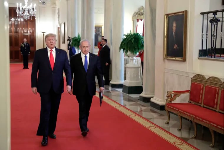 U.S. President Donald Trump and Prime Minister of Israel Benjamin Netanyahu arrive at joint remarks at the White House in Washington on Jan. 28, 2020. Trump proposed the creation of a Palestinian state with a capital in East Jerusalem.