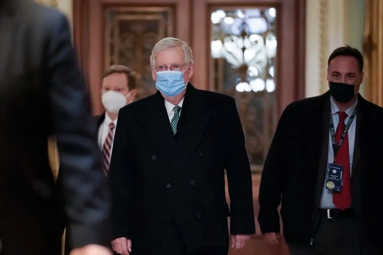 Senate Minority Leader Mitch McConnell arrives at the Capitol in Washington on Thursday. Arguments will be presented in the impeachment trial of former President Donald Trump.
