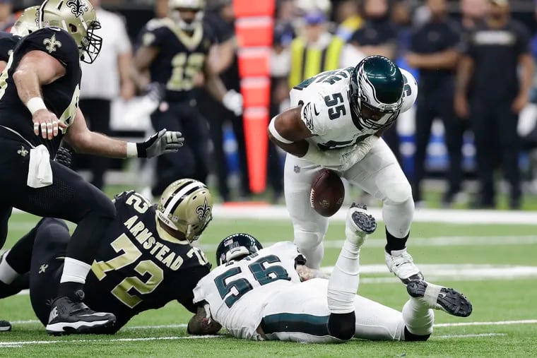 The football slips away from Brandon Graham after he sacked Drew Brees in the first quarter on Sunday and caused a fumble.
