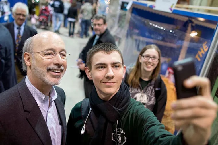 Tyler Robertshaw of York snapping a selfie with Gov.-elect Tom Wolf at the Pennsylvania Farm Show last week. Wolf will take office Tuesday.
