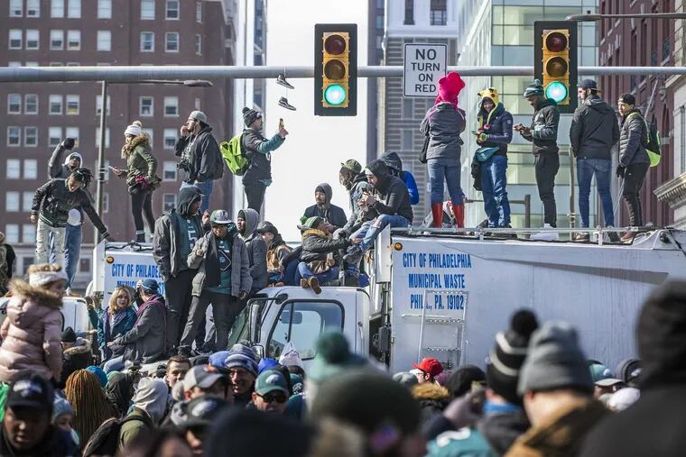 Eagles fans climbed on top of a city garbage truck to get a better view during the Super Bowl parade, which happened a year ago today.