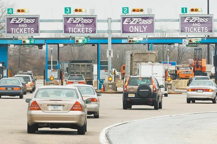 File Photo: Automobiles drive into the Fort Washington Interchange of the Pennsylvania Turnpike. Tolls on th turnpike go up Sunday.