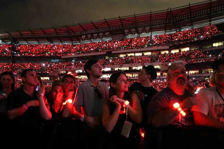 Fan's wristbands light up during a concert at Lincoln Financial Field in this August 2016 file photo. Eight of the top 10 concerts coming to Philly this year are outdoor shows.