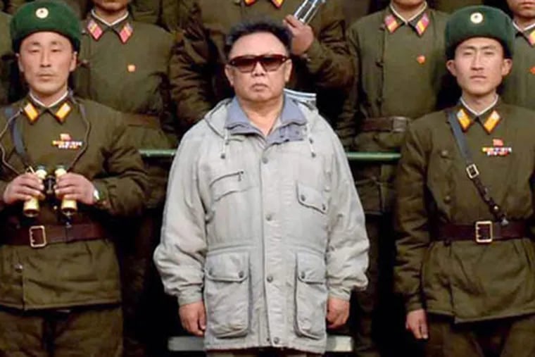 North Korean leader Kim Jong Il, center, poses  for a photograph with the soldiers of  Korean People's Army 821 unit, at an undisclosed area in North Korea, in this early April 2006 photo. (AP Photo/Korea Central News Agency via Korea News Service ) ** JAPAN OUT, NO SALES **