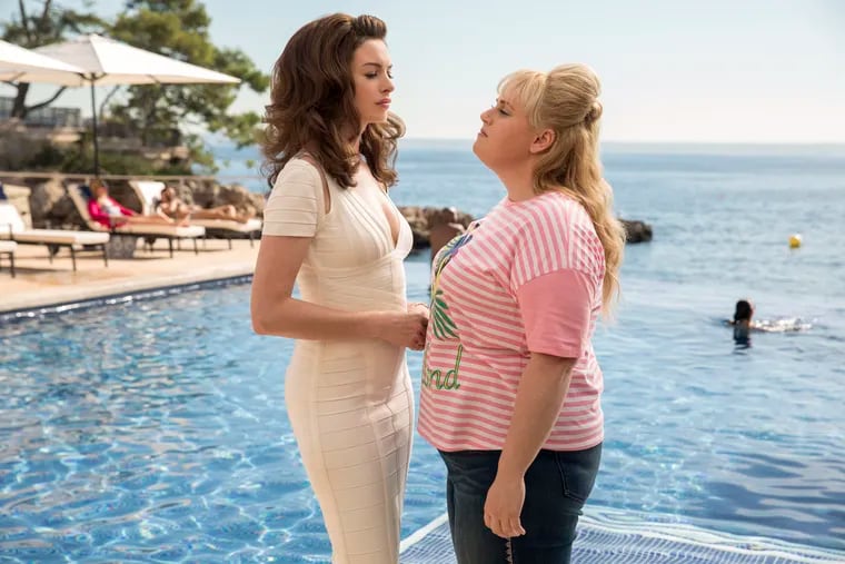Anne Hathaway as Josephine Chesterfield (left) and Rebel Wilson as Penny Rust in a scene from "The Hustle."