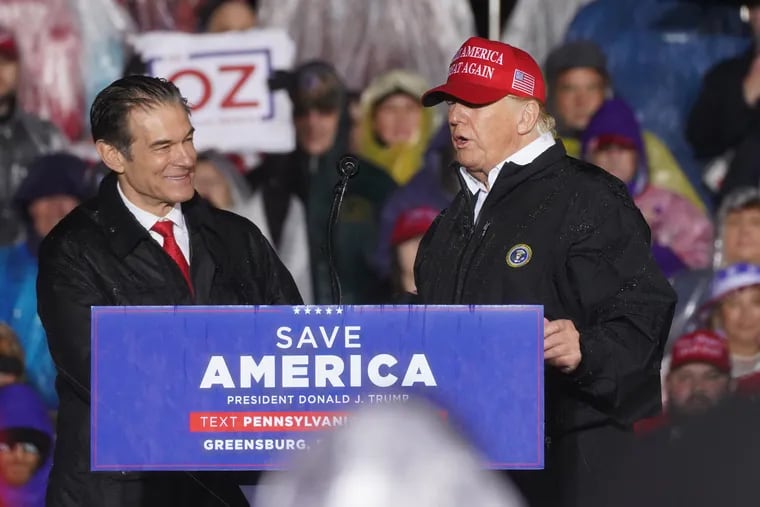 Senate candidate Mehmet Oz and former President Donald Trump share the stage during a May rally in Greensburg.