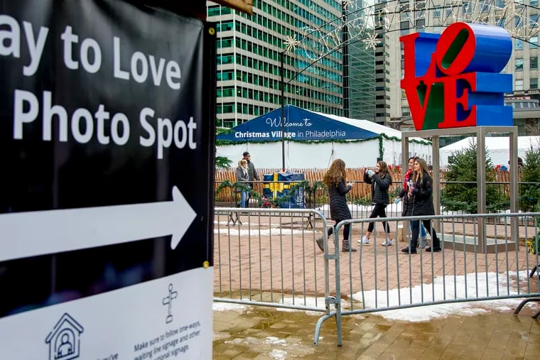 January 4, 2021: Thoughtful directions to artist Robert Indiana's LOVE sculpture (original rendering 1970, COR-TEN steel) during the just-passed annual Christmas Village shopping area in John F. Kennedy Plaza (LOVE Park).