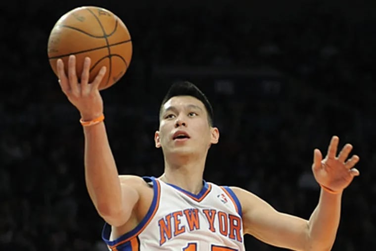 Guard Jeremy Lin has become a sensation for the Knicks. (AP Photo/Bill Kostroun)