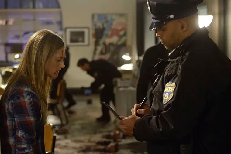 Marin Ireland , in a "Divide" scene with an actor playing a Philly cop. Note the authentic uniform.