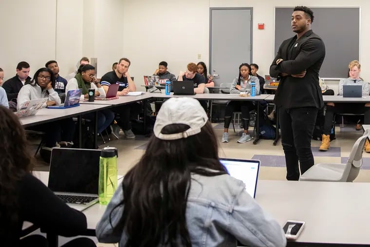 Brandon Copeland, linebacker for the New York Jets, teaches an Urban Studies course titled "Inequity and Empowerment: Urban Financial Literacy," at the University of Pennsylvania on Monday evening, Feb. 11, 2019. Copeland is a UPenn alum.