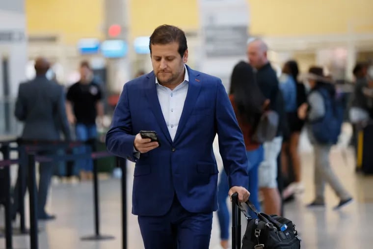 Business traveler Eric Goldmann, shown at Hartsfield-Jackson Atlanta International Airport, has resumed business travel after nearly two years off during the pandemic.