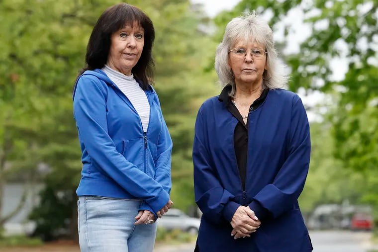 Sisters Karen Schiendelman (left) and Anne Bortner stand outside Schiendelman’s Sicklerville, N.J. neighborhood on Friday, May 10, 2024.  The two sister were investors with Joe Pezzano, a Collegeville, Pa., accountant who died last Christmas. They gave him the money they inherited from their parents. Now, they are among those who are trying to locate millions of dollars. Their brother, a retired PECO worker, had rolled his whole pension into the fund.