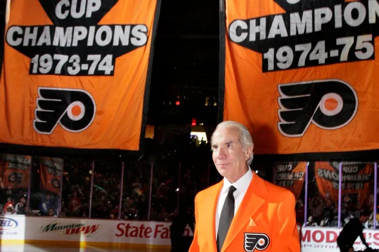 Flyers founder Ed Snider raising the team's two Stanley Cup banners before a Flyers-Phantoms exhibition game at the Spectrum on Oct. 7, 2008.